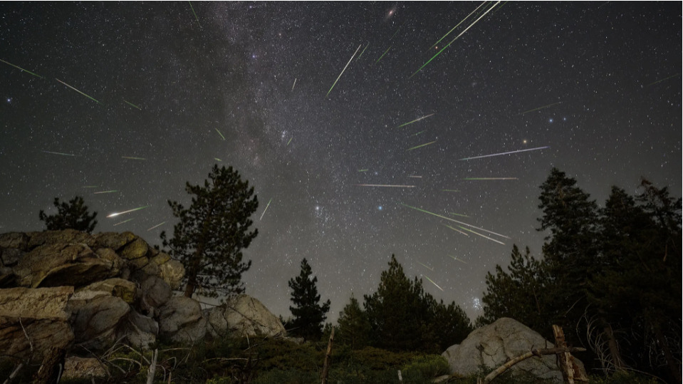 Perseid meteor shower with several meteor trails visible in the night sky